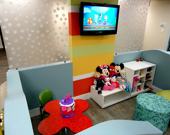 Birmingham waiting room with toys and tv