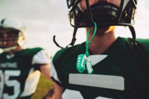 a boy with his mouthguard during football practice
